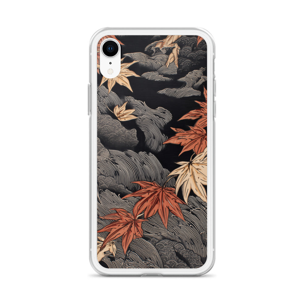 Clear iPhone case: Red and ochre maple leaves stretch across layered rocks and dark flowing water.